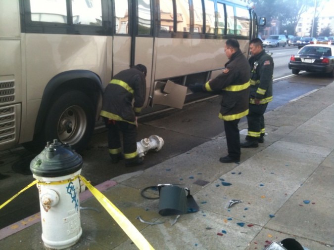 Fireman inspecting hydrant after it was removed from under bus conversion Fireman inspecting hydrant after it was removed from under bus conversion