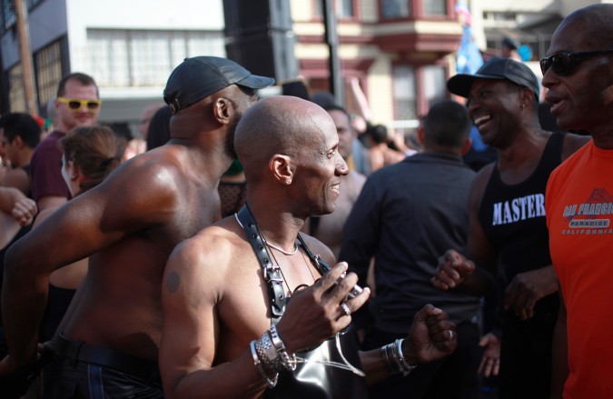 A group of men talking at the San Francisco Folsom Street Fair, September 23, 2012. 