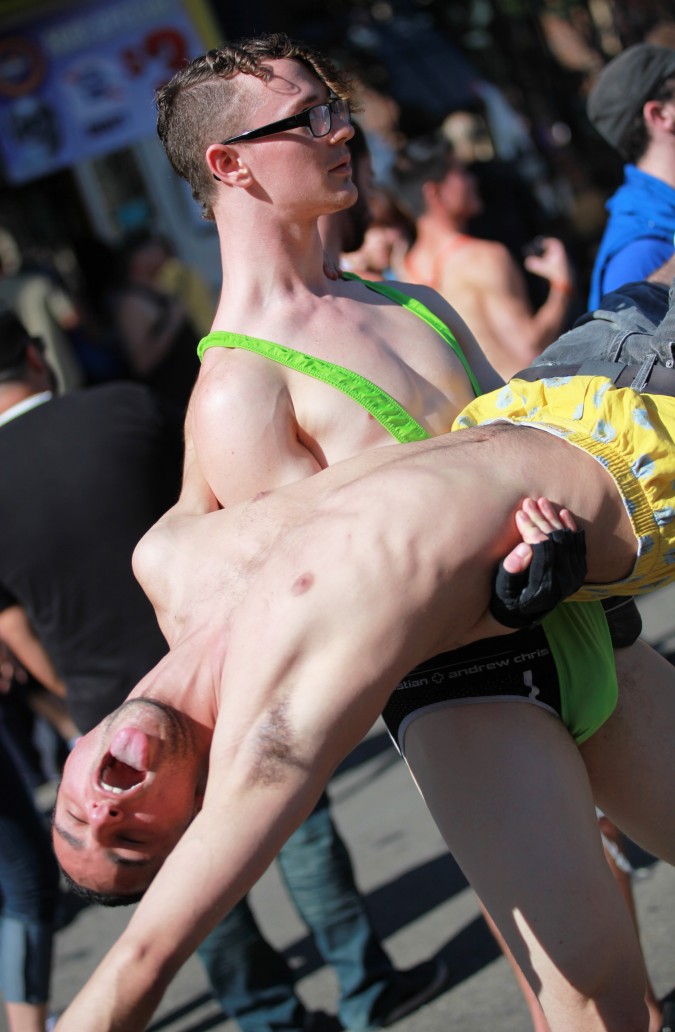 San Francisco Folsom Street Fair, September 23, 2012. Man lifting a man off the ground.