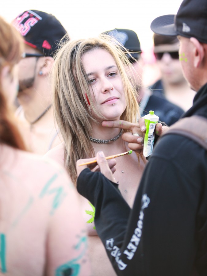 San Francisco Folsom Street Fair, September 23, 2012. Photo of woman having her body painted.