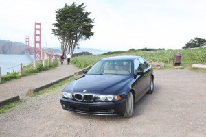 Kevin's BMW 525i in front of Golden Gate Bridge